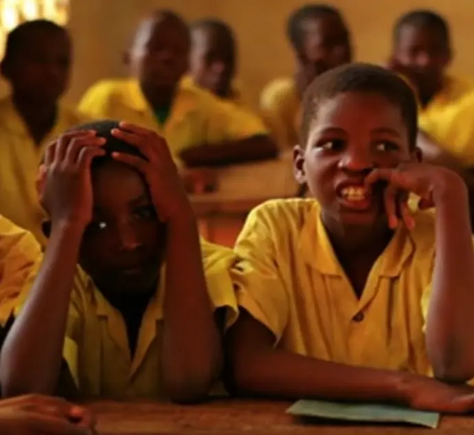 Young Black children in a classroom.